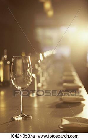 Stock Image - glasses, empty, bottles, bar, patterns, repetitions, distance. Fotosearch