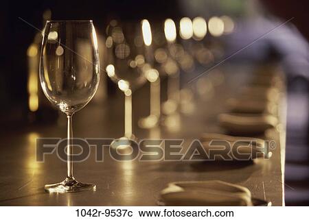 Stock Image - glasses, empty, wine, bottles, bar, patterns, repetitions. Fotosearch