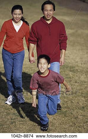 grass, people, walking, Asian, outdoors, park, family View Large Photo Image Picture - grass, people, walking, Asian, outdoors, park, family. Fotosearch