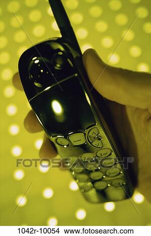hand, industry, phone, holding, communications, lights, cell phone View Large Photo Image Picture - hand, industry, phone, holding, communications, lights, cell phone. Fotosearch