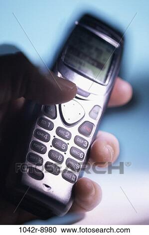 Stock Image - hand, industry, telephone, phone, holding, cell phone, cell. Fotosearch