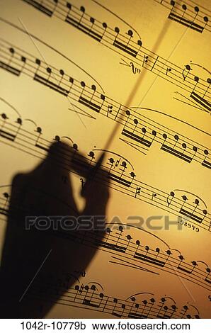 Stock Image - hand, music, silhouette, arts, notes, still life. Fotosearch