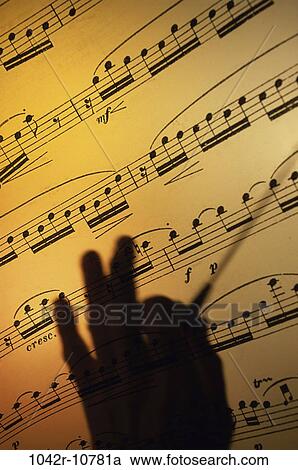 Stock Image - hand, music, silhouette, arts, notes, still life. Fotosearch