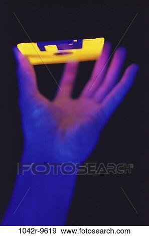 Stock Photo - , hand, technology, computer, holding, glowing, mystical. Fotosearch