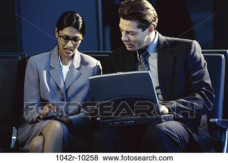 Hispanic, computer, laptop, business, indoors, PDA, businesspeople View Large Photo Image Stock Photo - Hispanic, computer, laptop, business, indoors, PDA, businesspeople. Fotosearch