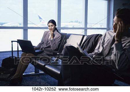 Hispanic, laptop, business, indoors, travel, airport, businesspeople View Large Photo Image Stock Image - Hispanic, laptop, business, indoors, travel, airport, businesspeople. Fotosearch