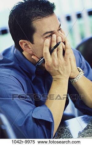 Stock Photography - Hispanic, stress, business, Middle-aged, businessman, indoors. Fotosearch
