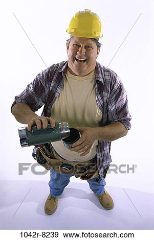 Stock Photo - industry, construction, pouring, drinking, laughing, worker. Fotosearch