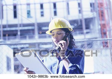 industry, construction, woman, talking, reading, worker, plans View Large Photo Image Stock Image - industry, construction, woman, talking, reading, worker, plans. Fotosearch