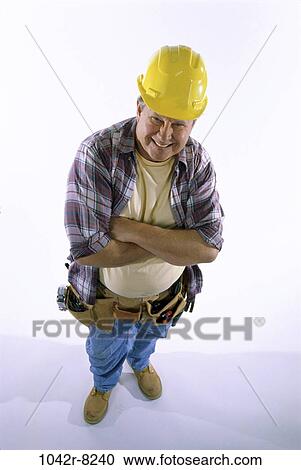 Stock Image - industry, construction, worker, Middle-aged, trade, overweight. Fotosearch