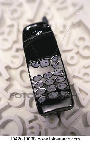 Stock Photo - industry, phone, communications, still life, cell phone, numbers, Communication telephone. Fotosearch