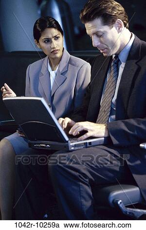laptop, business, serious, indoors, travel, Caucasian, businesspeople View Large Photo Image Stock Image - laptop, business, serious, indoors, travel, Caucasian, businesspeople. Fotosearch