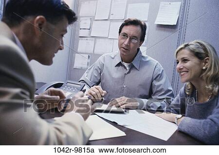 Stock Image - meeting, desk, consultation, business, Middle-aged, indoors, Caucasian. Fotosearch