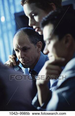 Stock Image - meeting, group, men, woman, telephone, phone, business. Fotosearch