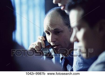 Stock Image - meeting, group, telephone, phone, business, Middle-aged, teamwork. Fotosearch