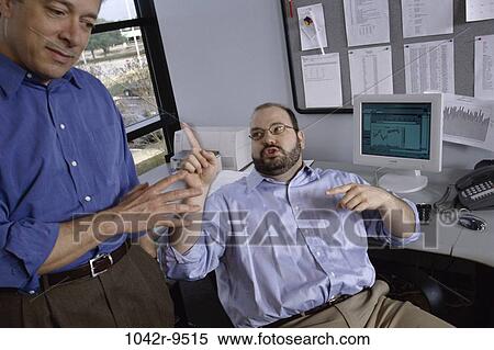 Stock Photography - meeting, men, desk, consultation, business, confrontation, Middle-aged. Fotosearch