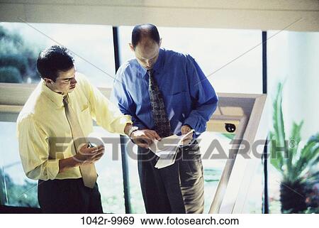 meeting, multiethnic, men, talking, papers, business, Middle-aged View Large Photo Image Stock Photo - meeting, multiethnic, men, talking, papers, business, Middle-aged. Fotosearch