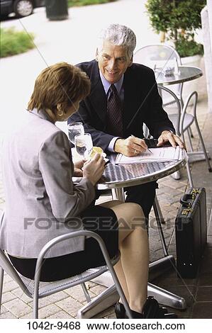 meeting, paper, briefcase, business, outdoors, writing, teamwork View Large Photo Image Stock Photo - meeting, paper, briefcase, business, outdoors, writing, teamwork. Fotosearch