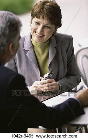 meeting, smiling, consultation, listening, phone, business, outdoors View Large Photo Image Stock Photography - meeting, smiling, consultation, listening, phone, business, outdoors. Fotosearch