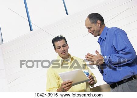 Stock Photography - men, hallway, business, Middle-aged, businessmen, indoors, Caucasian. Fotosearch