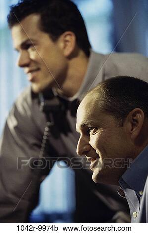 Stock Image - men, telephone, Hispanic, phone, business, Middle-aged, businessmen. Fotosearch