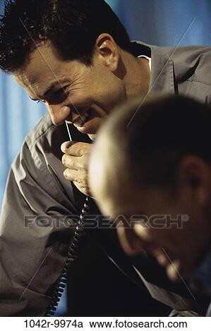 Stock Image - men, telephone, talking, phone, business, Middle-aged, businessmen. Fotosearch