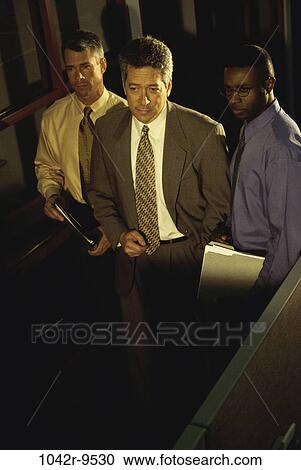 Stock Image - multiethnic, men, business, Middle-aged, businessmen, indoors, Businessmen together. Fotosearch
