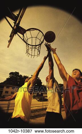 Stock Photo - multiethnic, men, people, playing, ball, outdoors, basketball. Fotosearch
