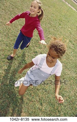 multiethnic, people, running, playing, outdoors, friends, children View Large Photo Image Stock Photography - multiethnic, people, running, playing, outdoors, friends, children. Fotosearch
