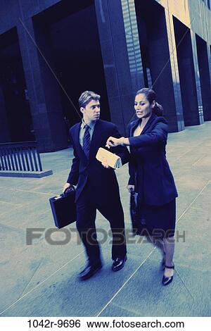 multiethnic, time, rush, watch, business, outdoors, Middle-aged View Large Photo Image Stock Photograph - multiethnic, time, rush, watch, business, outdoors, Middle-aged. Fotosearch