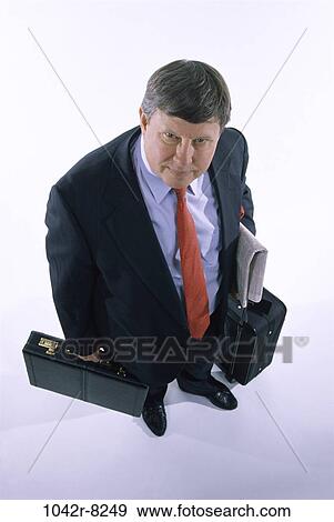 newspaper, briefcase, luggage, business, Middle-aged, businessman View Large Photo Image Stock Photo - newspaper, briefcase, luggage, business, Middle-aged, businessman. Fotosearch