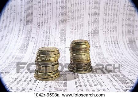Stock Image - paper, finance, stock market, still life, coins, currency, stock. Fotosearch