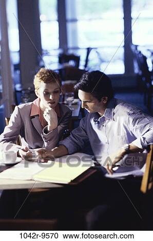 Stock Image - papers, business, teamwork, planning, forms, indoors, businesspeople. Fotosearch