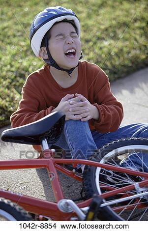 Picture - people, Asian, bicycle, helmet, crying, injury, boy. Fotosearch