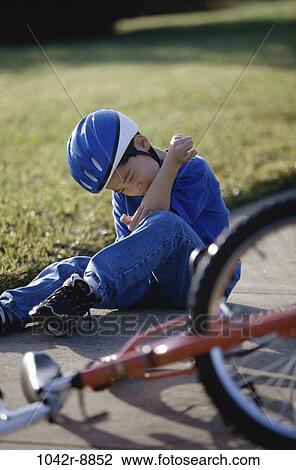 Stock Image - people, Asian, bicycle, helmet, injury, boy, outdoors. Fotosearch