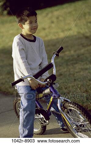 people, Asian, bicycle, riding, boy, outdoors, bike View Large Photo Image Stock Image - people, Asian, bicycle, riding, boy, outdoors, bike. Fotosearch