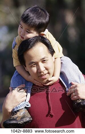 people, Asian, outdoors, carrying, family, affection View Large Photo Image Stock Image - people, Asian, outdoors, carrying, family, affection. Fotosearch