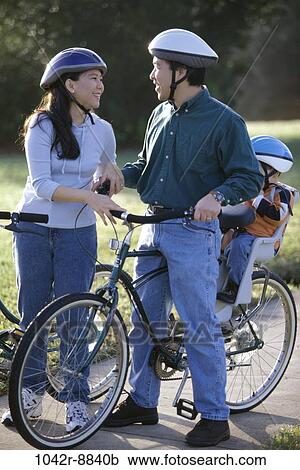 people, Asian, riding, bicycles, family, sidewalk View Large Photo Image Stock Image - people, Asian, riding, bicycles, family, sidewalk. Fotosearch