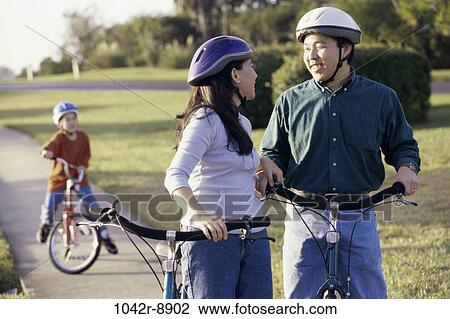 people, Asian, riding, outdoors, bicycles, family View Large Photo Image Stock Image - people, Asian, riding, outdoors, bicycles, family. Fotosearch