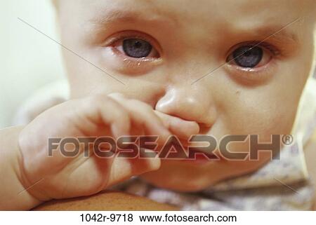 Stock Photo - people, baby, crying, frustrated, sad, indoors, Caucasian. Fotosearch