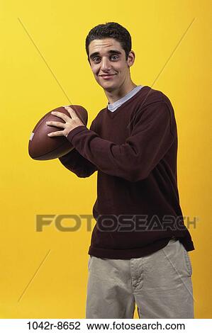 people, ball, football, indoors, teenager View Large Photo Image Stock Image - people, ball, football, indoors, teenager. Fotosearch
