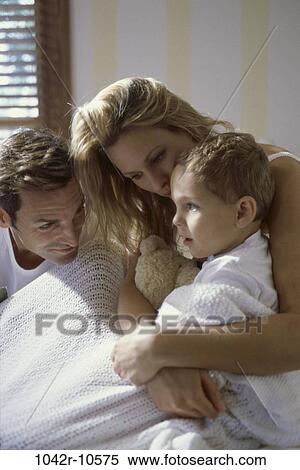 people, bed, hugging, family, blond, comforting View Large Photo Image Stock Photography - people, bed, hugging, family, blond, comforting. Fotosearch