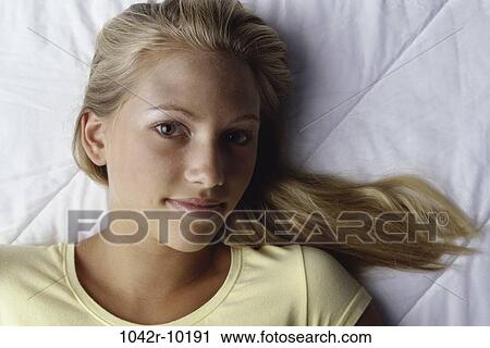 Stock Image - people, blond, indoors, teenager, female, headshot. Fotosearch