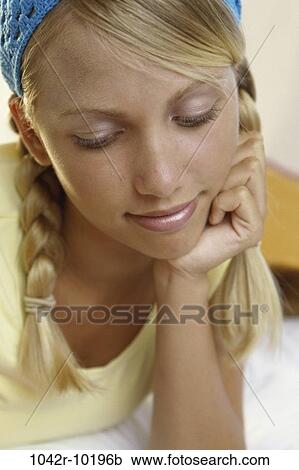 Stock Image - people, blond, indoors, teenager, female, headshot. Fotosearch