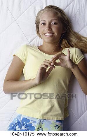 people, blond, laying, indoors, teenager, female View Large Photo Image Stock Photography - people, blond, laying, indoors, teenager, female. Fotosearch