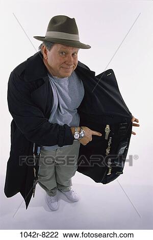 people, coat, hat, senior, salesman, showing View Large Photo Image Stock Image - people, coat, hat, senior, salesman, showing. Fotosearch