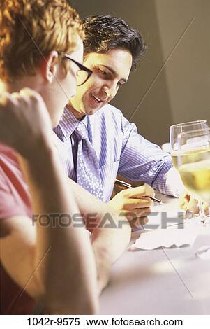 people, couple, drinking, business, writing, teamwork, restaurant View Large Photo Image Stock Photography - people, couple, drinking, business, writing, teamwork, restaurant. Fotosearch