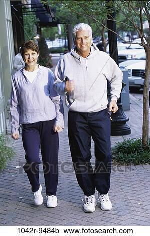 Stock Image - people, couple, jogging, outdoors, Middle-aged, exercise, Caucasian. Fotosearch
