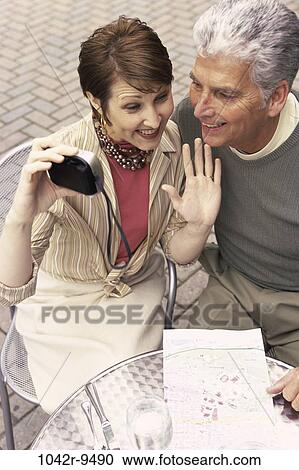 people, couple, map, outdoors, Middle-aged, dining out, camera View Large Photo Image Stock Image - people, couple, map, outdoors, Middle-aged, dining out, camera. Fotosearch