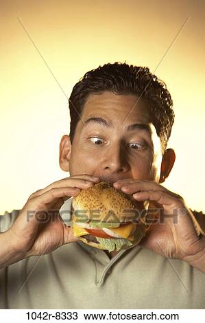 people, eating, hamburger, food, fast food, hungry View Large Photo Image Stock Image - people, eating, hamburger, food, fast food, hungry. Fotosearch